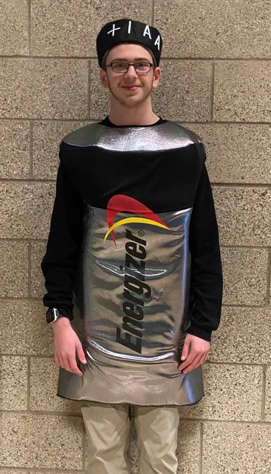 Man dressed in a battery costume.